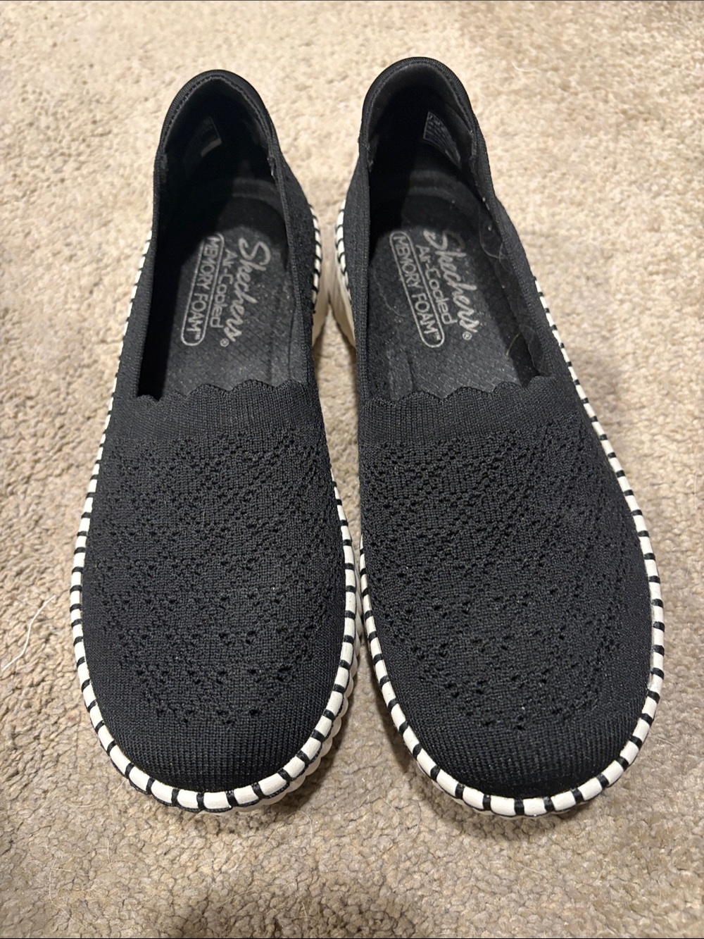 Skechers Women's Black Slip-On Knit Flats with White-Striped Sole